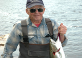 Fisherman with Steelhead